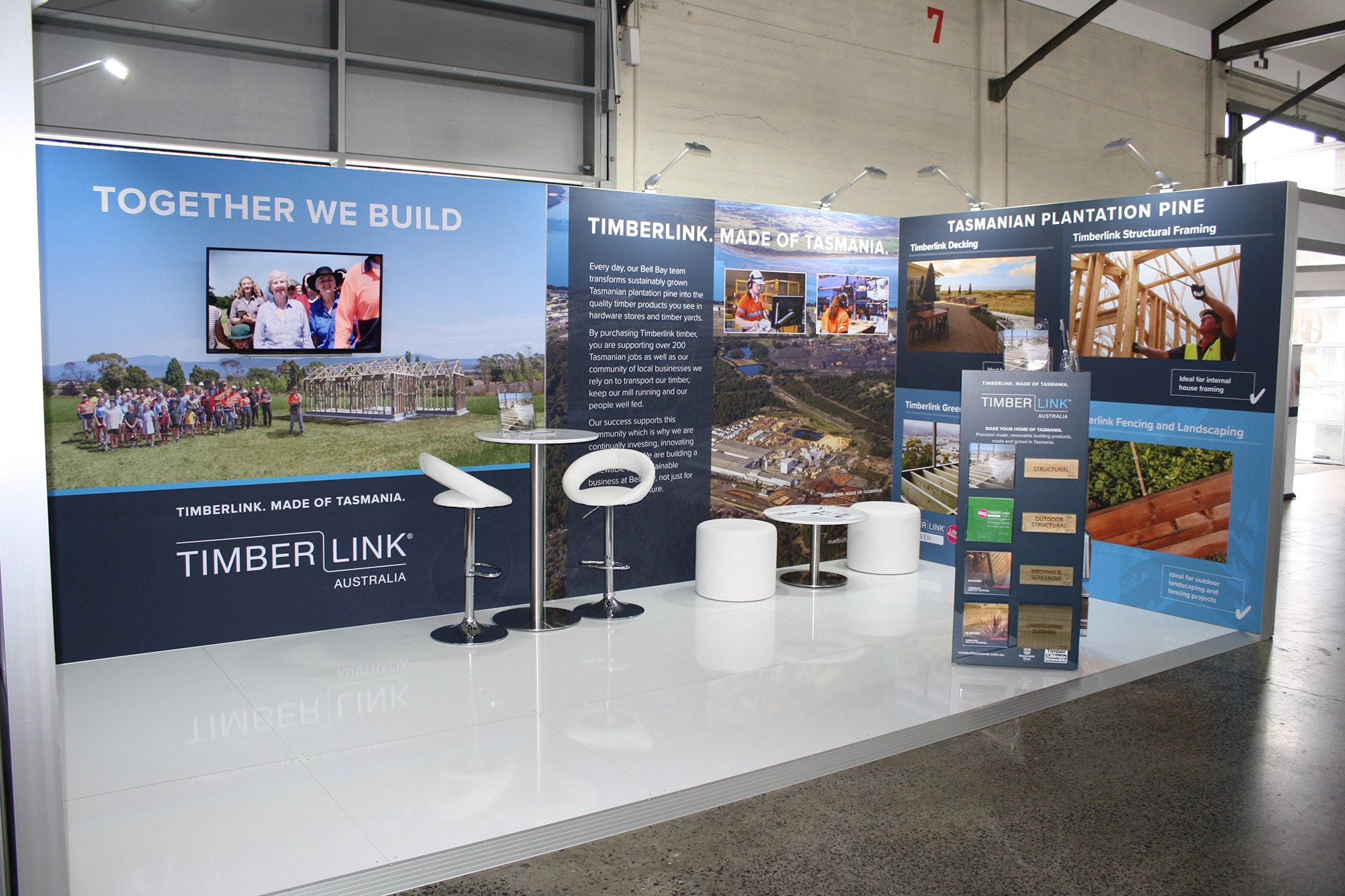 Photograph showing a convention display booth adorned with timberlink branding